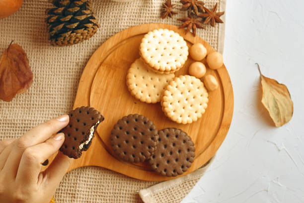istock Woman eating cookies. 1180893530