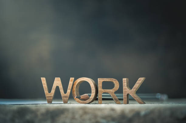 istock Wooden work letter with pencil for working concept for content background. 1180894334