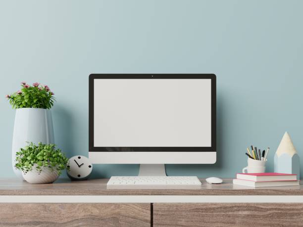 istock Workspace mockup desk with desktop computer with house plant and office supplies. 1180895565