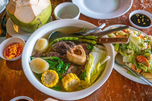 Philippines traditional cuisine with bulalo beef marrow bones and vegetables