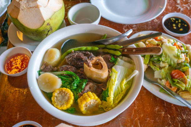 Philippines traditional dinner with bulalo beef marrow bones and vegetables stock photo