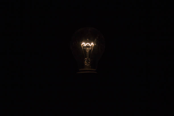 istock Bulb vintage in the darkness 1180902095