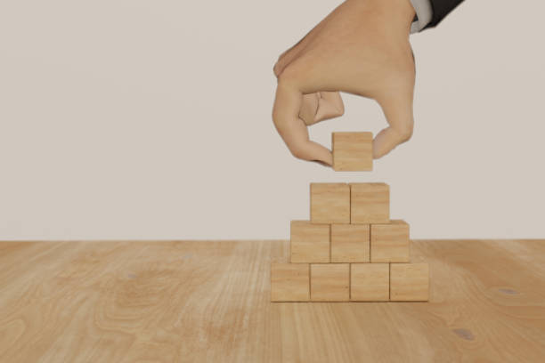 istock 3d rendering hand man flip wooden cube with growth successful process concept, 1180902280