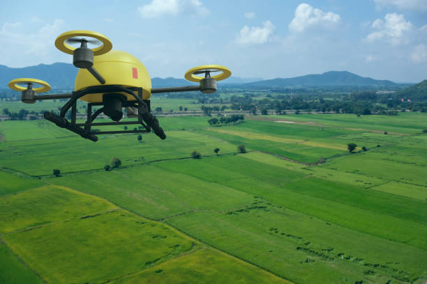 istock drone for agriculture, drone use for various fields like research analysis, safety,rescue, terrain scanning technology, monitoring soil hydration ,yield problem and send data to smart farmer on tablet 1180902284