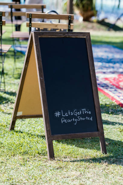 istock Wedding Ceremony Chalkboard At Australian Outdoor Wedding Reception 1180904355