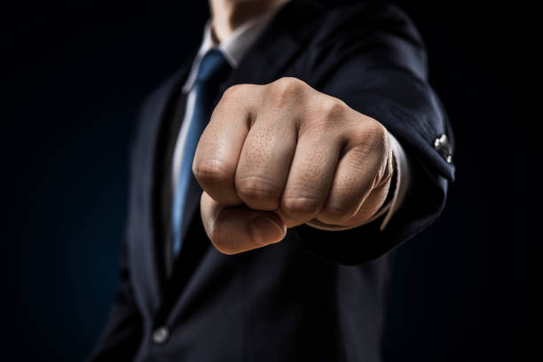 istock Businessman sticking out fist 1180905490