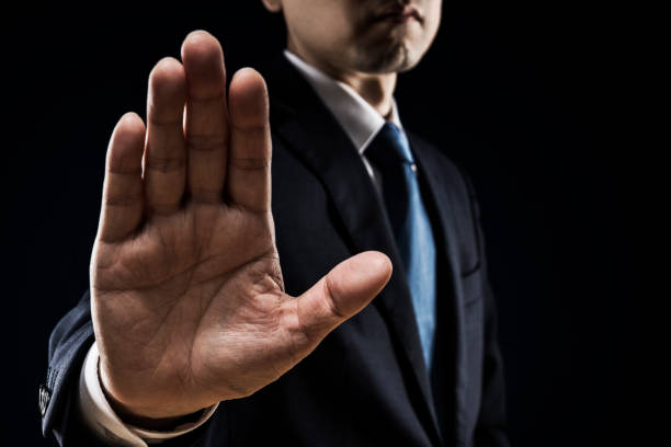 istock Businessman sticking out his hand 1180905515