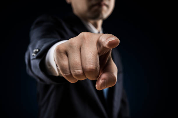 istock Businessman sticks out a finger and reproves it. 1180905610