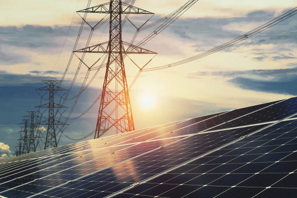 istock Solar panels with electricity pylon and sunset. Clean energy concept. power alternative 1180906483
