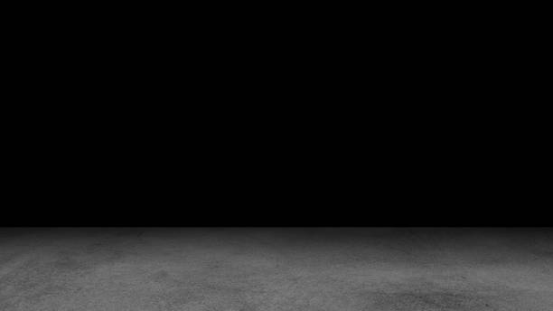 istock Cement floor background on studio room and spot light.Between darkness 1180909635