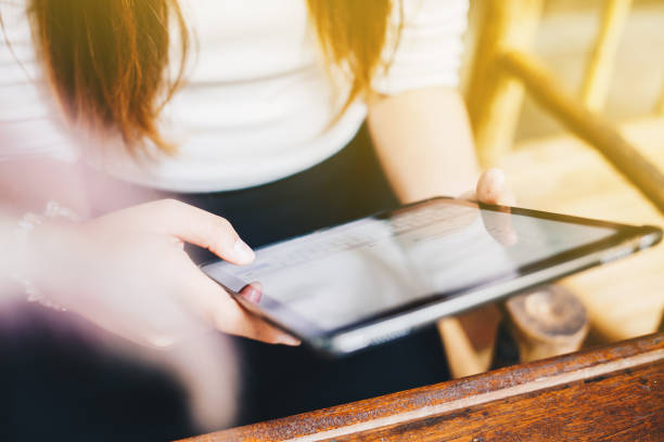 istock Business women using smart tablet computer close up on hand 1180910417