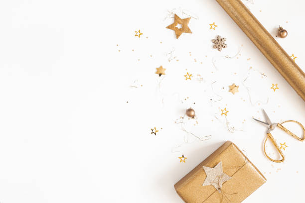 istock Christmas composition. Gift box, golden decorations on white background. Christmas, winter, new year concept. Flat lay, top view, copy space 1180911134