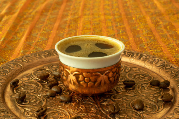 istock Hot Turkish coffee cup on the copper plate with roasted coffee beans 1180911162