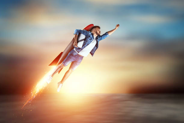 istock A man flies on a rocket, delivers parcels. Super fast delivery, cool service, online purchase. Copy space, Mixed media 1180911239