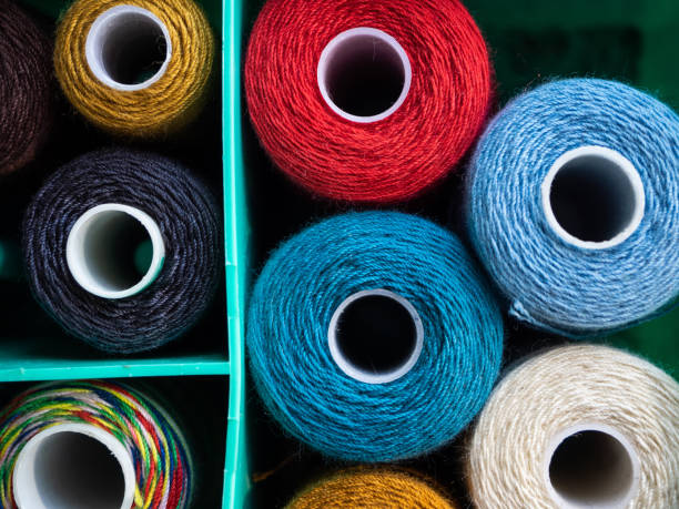 istock Reels with threads of different colors for sewing. Threads located in the box. The view from the top on threads for sewing. 1180912167