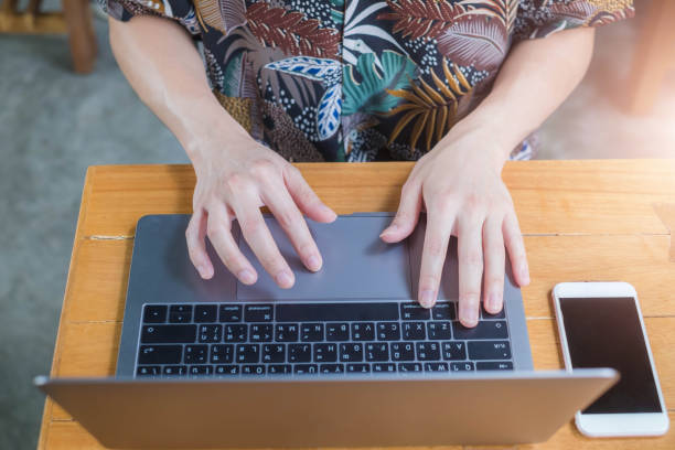 istock Close up of business man hands typing on laptop computer 1180912361