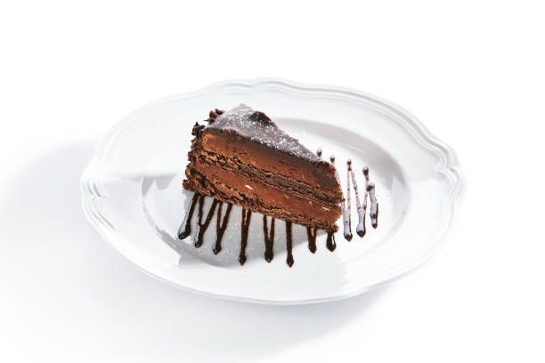 istock Chocolate Cake, Triangular Slice of Brown Biscuit Tart or Sachertorte 1180912403