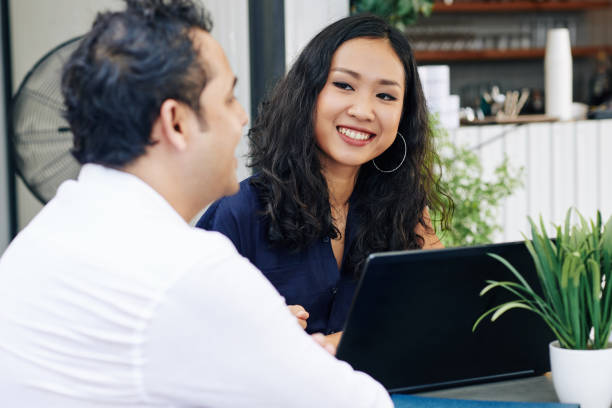 istock Business lady looking at talking coworker 1180915188