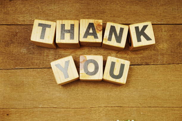 istock Thank You alphabet letters on wooden background 1180916457
