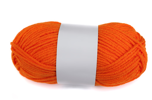 Orange yarn skein on white background with blank band