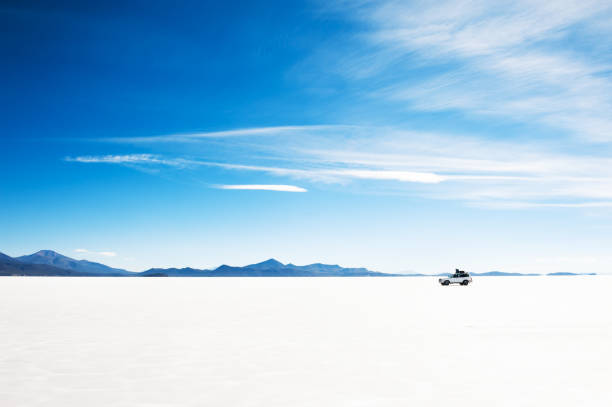 istock Off-road car driving on Salar de Uyuni salt flat, Bolivia 1180919110