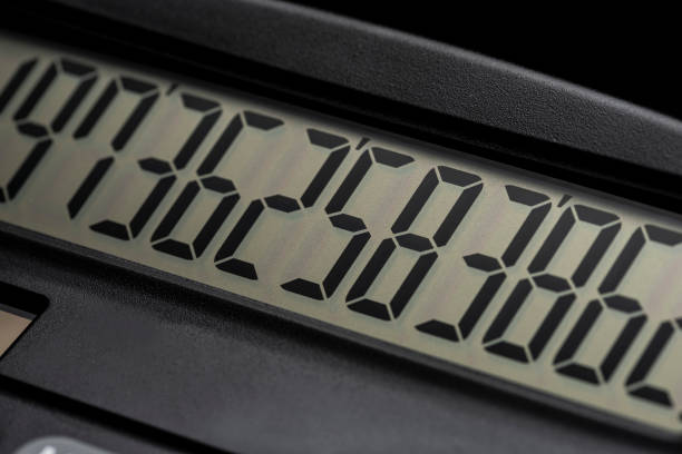 istock Close up of calculator on black background. 1180919201