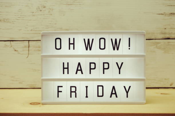 istock Happy Friday text in light box with space copy on wooden background 1180920481
