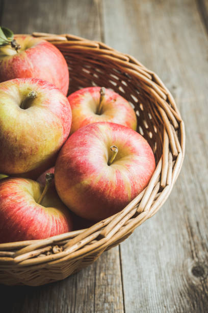 istock Freshly harvested ripe apple on the rustic wooden background 1180922078
