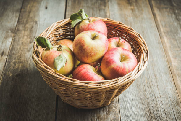 istock Freshly harvested ripe apple on the rustic wooden background 1180922107
