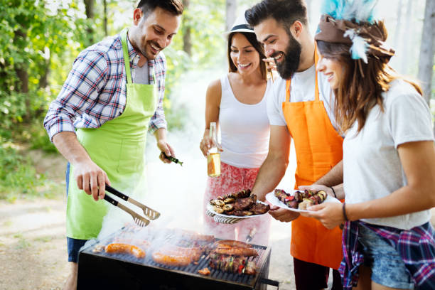 istock Friends having fun in nature doing bbq 1180922436