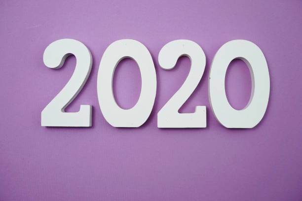 istock 2020 happy new year with space copy on purple background 1180922561