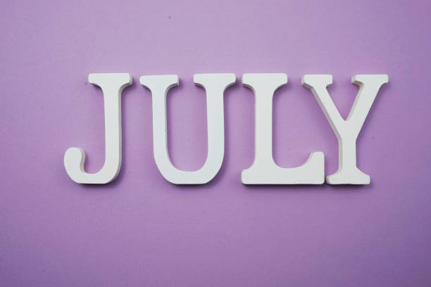 istock July alphabet letter with space copy on Purple background 1180925025