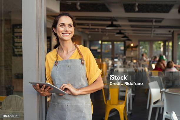 Successful Owner Standing At Cafe Entrance Stock Photo - Download Image Now - Small Business, Owner, Business