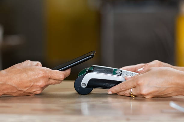 istock Paying with contactless smartphone 1180925170