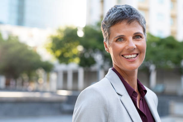 istock Successful mature business woman smiling 1180925966