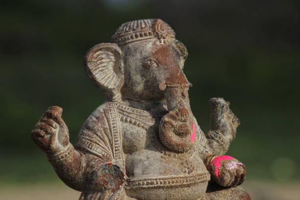 istock Ganapathi or vinayagar or ganesh handmade small statue in the sea after it vinayagar chaturthi festival. sea sands are filled in the statue 1180926725