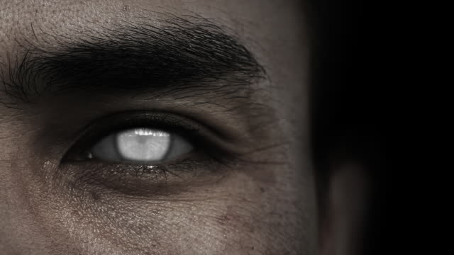 Close up of Zombie white eyes with black background