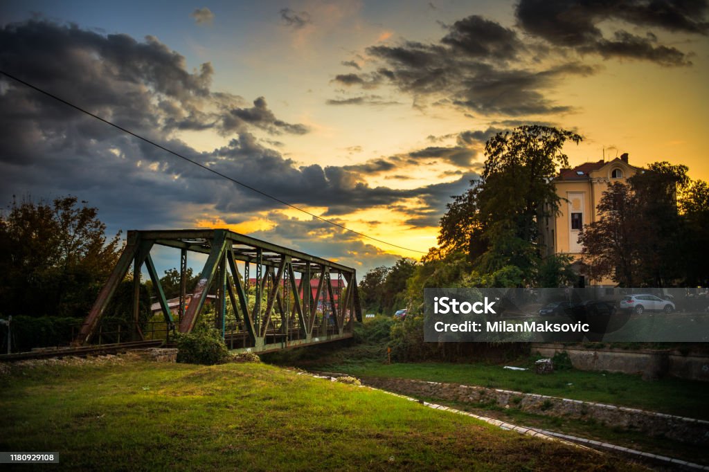 Sunset in town by the river Kragujevac, Serbia - september 25 2019: Old railway bridge on Lepenica river in Kragujevac, Serbia, at sunset Ancient Stock Photo