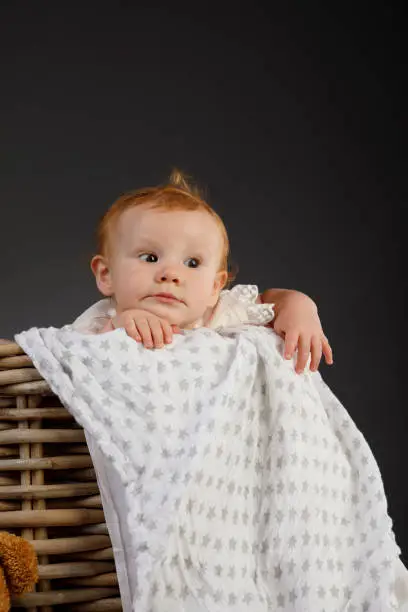 Photo of Baby Portrait cute baby girl  Playing in basket