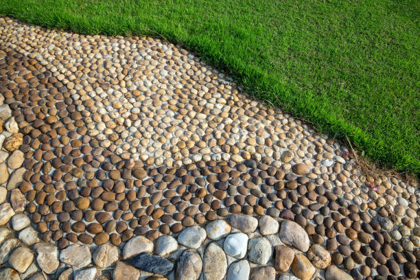 Healthy stone floor pattern in the park. Healthy stone floor pattern in the park. reflexology stone massaging human foot stock pictures, royalty-free photos & images