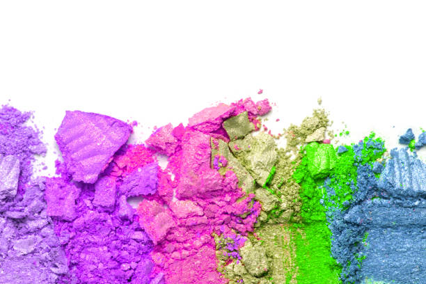 istock A broken rainbow colored eye shadow smear, make up palette isolated on a white background. 1180931881