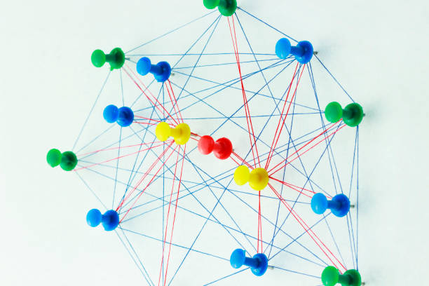 istock The colored needles are interconnected by a thread, the concept of interaction with each other, and each of them is separately connected with needles of a different color, which are separately connect 1180934552