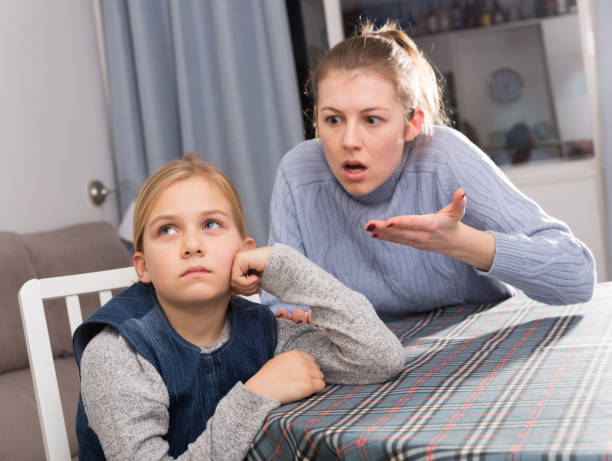 istock Serious mother scolding her daughter 1180937001