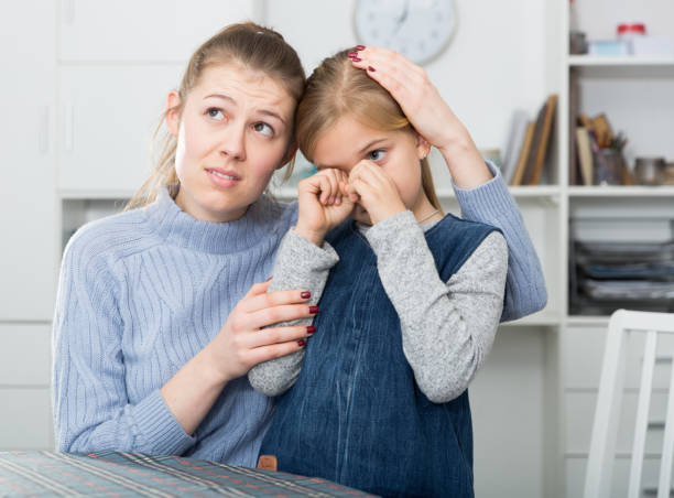 istock Mother soothes little daughter after an quarrel 1180937094