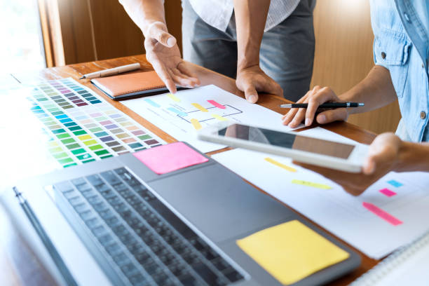 istock Midsection Of Design Professionals Working On Desk In Office 1180937185