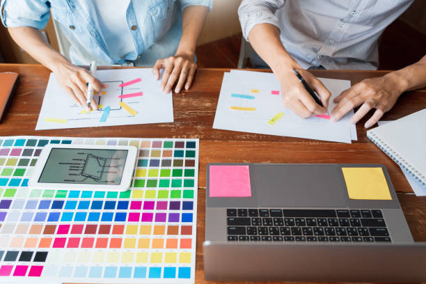 istock Midsection Of Design Professionals Working On Desk In Office 1180937203