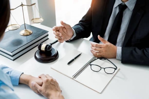 istock Midsection Of Lawyer Discussing With Customer At Table 1180938232