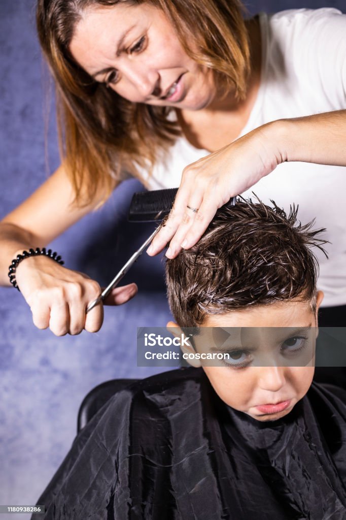 Beautiful Boy Getting A Haircut With Scissors Stock Photo - Download Image  Now - Adult, Barber Shop, Beauty - iStock
