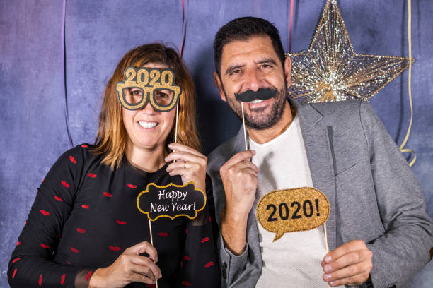 istock Middle aged couple celebrating New Yaers Eve 1180938352