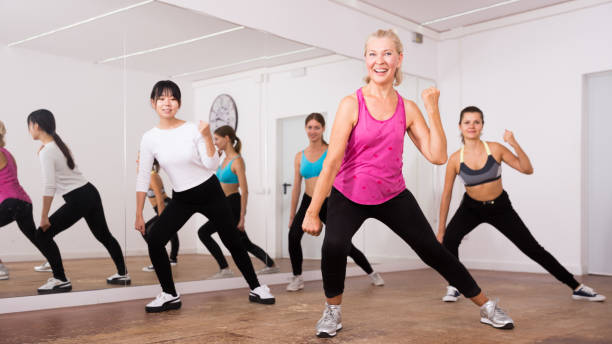 istock Women dancing aerobics at lesson in the dance class 1180942449